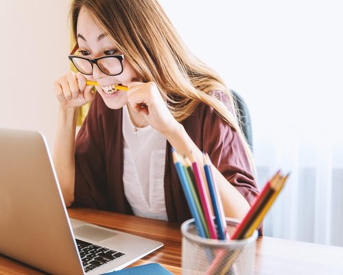 Person stretching gently at an office desk